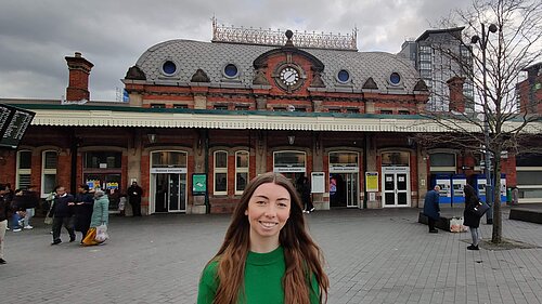 Chelsea Whyte, Parliamentary Candidate for Slough in front of Slough Station